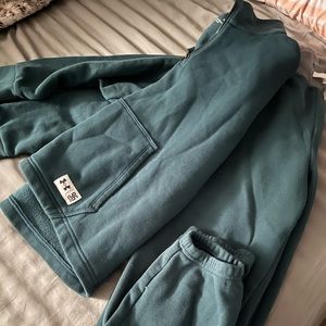 Teal green track suit